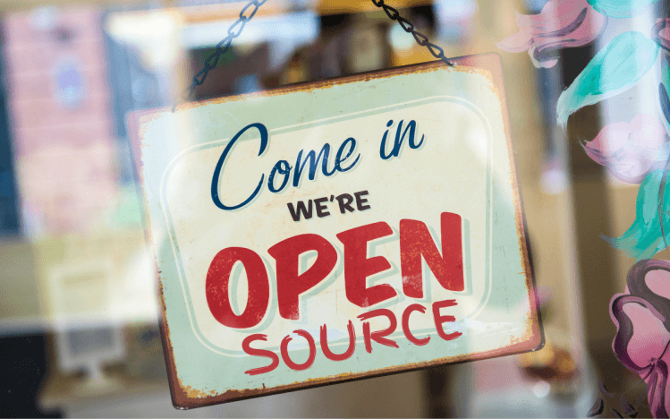 A storefront-style sign that reads: "Come in; we are open source" ā image source: venturebeat.com.